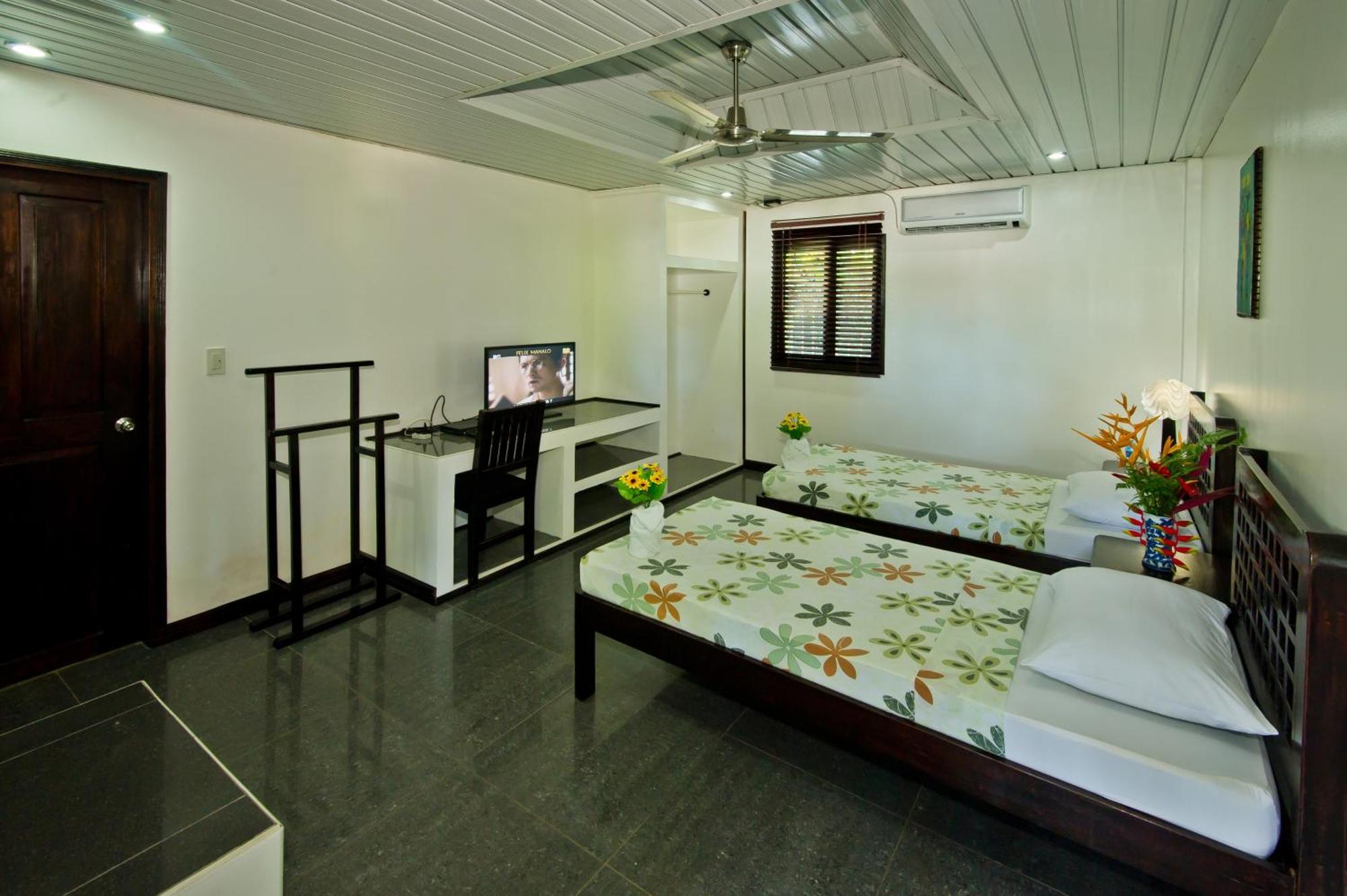 Balay Tuko Garden Inn Puerto Princesa Szoba fotó